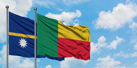 Nauru and Benin flag waving in the wind against white cloudy blue sky together. Diplomacy concept, international relations.