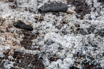 Ashes burned in the grill