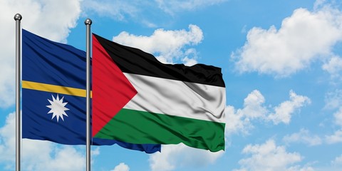 Nauru and Palestine flag waving in the wind against white cloudy blue sky together. Diplomacy concept, international relations.