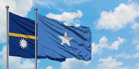 Nauru and Somalia flag waving in the wind against white cloudy blue sky together. Diplomacy concept, international relations.