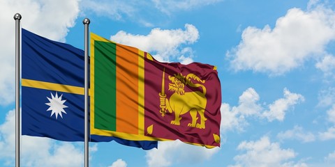 Nauru and Sri Lanka flag waving in the wind against white cloudy blue sky together. Diplomacy concept, international relations.