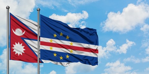 Nepal and Cape Verde flag waving in the wind against white cloudy blue sky together. Diplomacy concept, international relations.