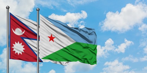 Nepal and Djibouti flag waving in the wind against white cloudy blue sky together. Diplomacy concept, international relations.
