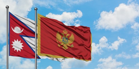 Nepal and Montenegro flag waving in the wind against white cloudy blue sky together. Diplomacy concept, international relations.