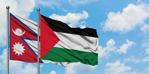 Nepal and Palestine flag waving in the wind against white cloudy blue sky together. Diplomacy concept, international relations.