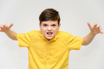 Concept boy teenager shows imitates the behavior of heroes from different movies. Portrait of a...