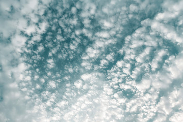 Fototapeta na wymiar Fluffy white clouds flying on blue sky background