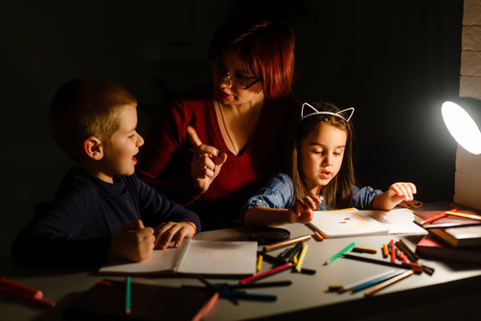 Children With Mom Do Their Homework At Night