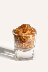 ์Natural Rock Sugar on Cocktail glass isolate on white background.