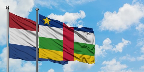Netherlands and Central African Republic flag waving in the wind against white cloudy blue sky together. Diplomacy concept, international relations.