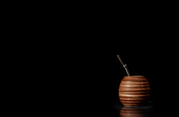 Beautiful composition of yerba mate on a black background - Juicy and green leaves without sticks