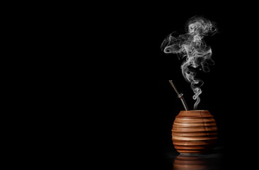 Beautiful composition of yerba mate on a black background - Juicy and green leaves without sticks