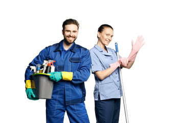 Attractive young woman and man  in cleaning uniform and rubber gloves holding  a mop and  a bucket of cleaning products in his hands, isolated on white background. - obrazy, fototapety, plakaty