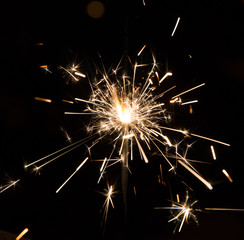 Obraz premium Bengal fire sparkles isolated on black background. Fascinating Bengal Fire Dance