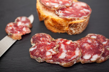 pork dry sausage on a slate plate