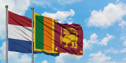 Netherlands and Sri Lanka flag waving in the wind against white cloudy blue sky together. Diplomacy concept, international relations.