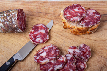 pork dry sausage on cutting board
