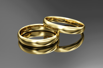 Golden Wedding Rings on black reflective background. 3D Rendering