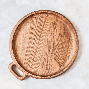 Round Wooden Dish on Grey Background
