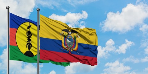 New Caledonia and Ecuador flag waving in the wind against white cloudy blue sky together. Diplomacy concept, international relations.
