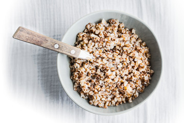 Bowl with buckwheat. Closeup. Top view.