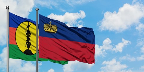 New Caledonia and Liechtenstein flag waving in the wind against white cloudy blue sky together. Diplomacy concept, international relations.