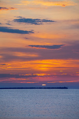 Beautiful sunrise at the sea. Autumn sea sunrise. 