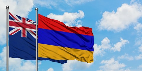 Fototapeta na wymiar New Zealand and Armenia flag waving in the wind against white cloudy blue sky together. Diplomacy concept, international relations.