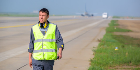 airport worker arrival landing runway outside male