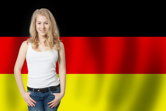 Travel in Germany concept. Pretty woman against the Germany flag background