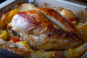 Baked Chicken Breast. Rosy chicken and potatoes.