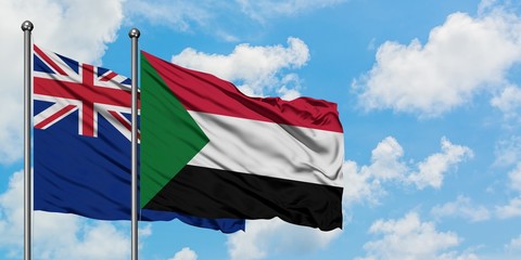 New Zealand and Sudan flag waving in the wind against white cloudy blue sky together. Diplomacy concept, international relations.