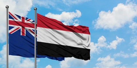 New Zealand and Yemen flag waving in the wind against white cloudy blue sky together. Diplomacy concept, international relations.