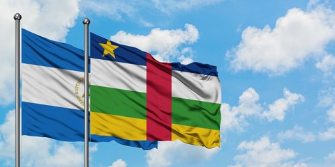 Nicaragua and Central African Republic flag waving in the wind against white cloudy blue sky together. Diplomacy concept, international relations.