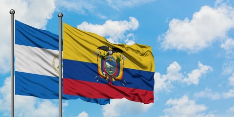 Nicaragua and Ecuador flag waving in the wind against white cloudy blue sky together. Diplomacy concept, international relations.