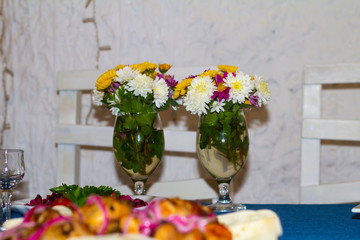 bouquet of flowers in a vase on wooden table
