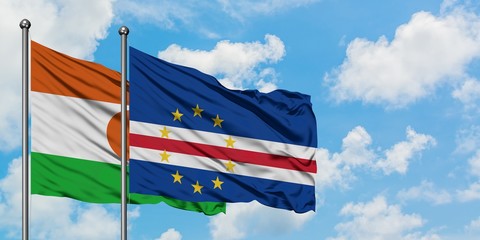 Niger and Cape Verde flag waving in the wind against white cloudy blue sky together. Diplomacy concept, international relations.