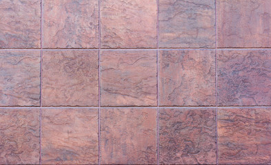 Decorative tiles of brown stone, background.The texture of the stone tiles.