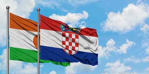 Niger and Croatia flag waving in the wind against white cloudy blue sky together. Diplomacy concept, international relations.