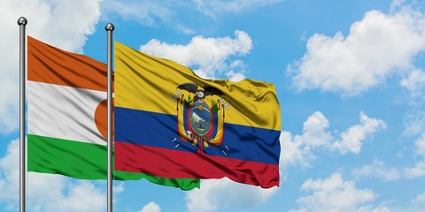 Niger and Ecuador flag waving in the wind against white cloudy blue sky together. Diplomacy concept, international relations.