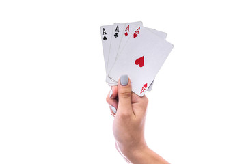 Gambling concept. Female hand holding combination of four aces isolated on white