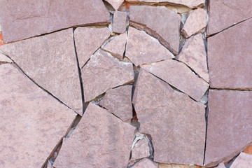 Obraz premium Stone wall, the texture of the outer wall, finished with decorative stone of various shapes