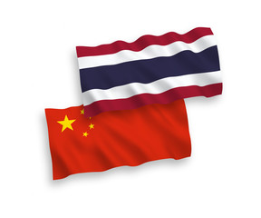 National vector fabric wave flags of Thailand and China isolated on white background 1 to 2 proportion.