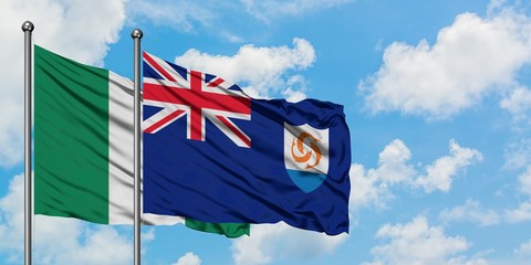 Nigeria and Anguilla flag waving in the wind against white cloudy blue sky together. Diplomacy concept, international relations.