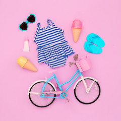 Vacation beach set. Ice cream, flip-flop, sunglasses, swimsuit, bicycle. Minimal flat lay