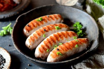 Homemade sausages from turkey (chicken) fried in a frying pan
