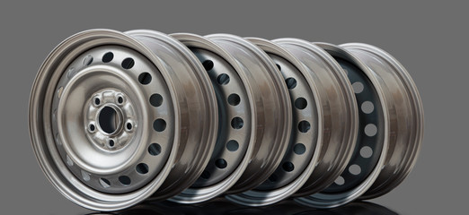4 Steel wheel rim on grey background