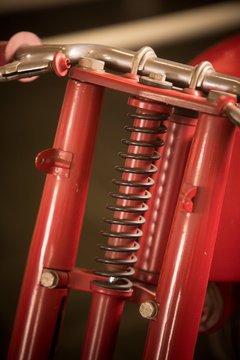 Front suspension of a red vintage motorcycle