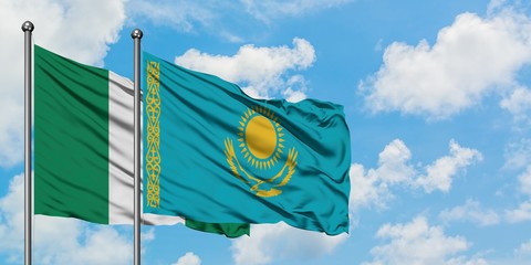 Nigeria and Kazakhstan flag waving in the wind against white cloudy blue sky together. Diplomacy concept, international relations.