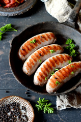 Homemade sausages from turkey (chicken) fried in a frying pan